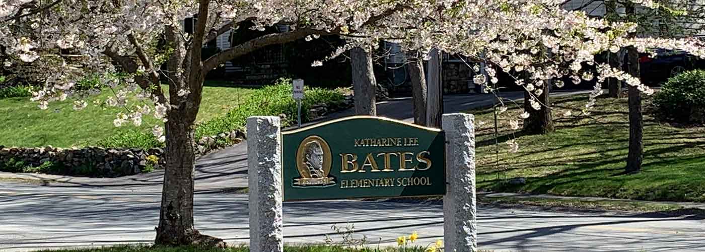 Bates sign under flowering tree in spring