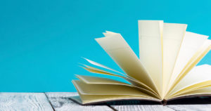 Book on a dock with a blue sky